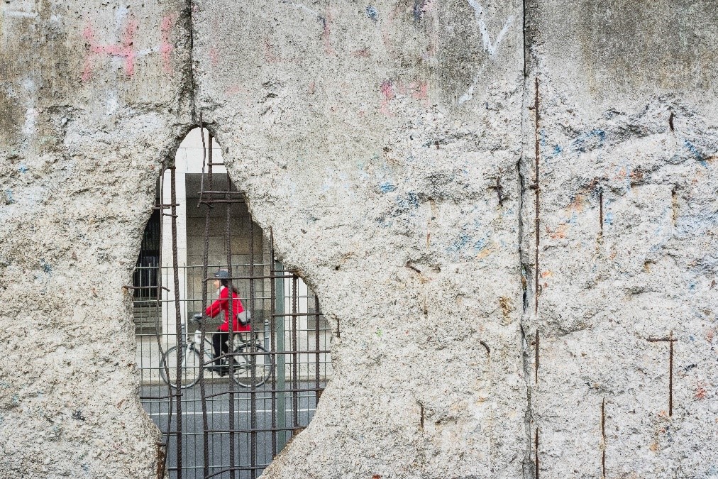 Wall plus cyclist in red